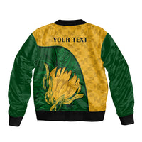 Yellow green bomber jacket back with 'YOUR TEXT' and Protea graphic, ribbed hem