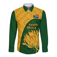 Unisex long sleeve button shirt with yellow kente pattern, green sides, South Africa print