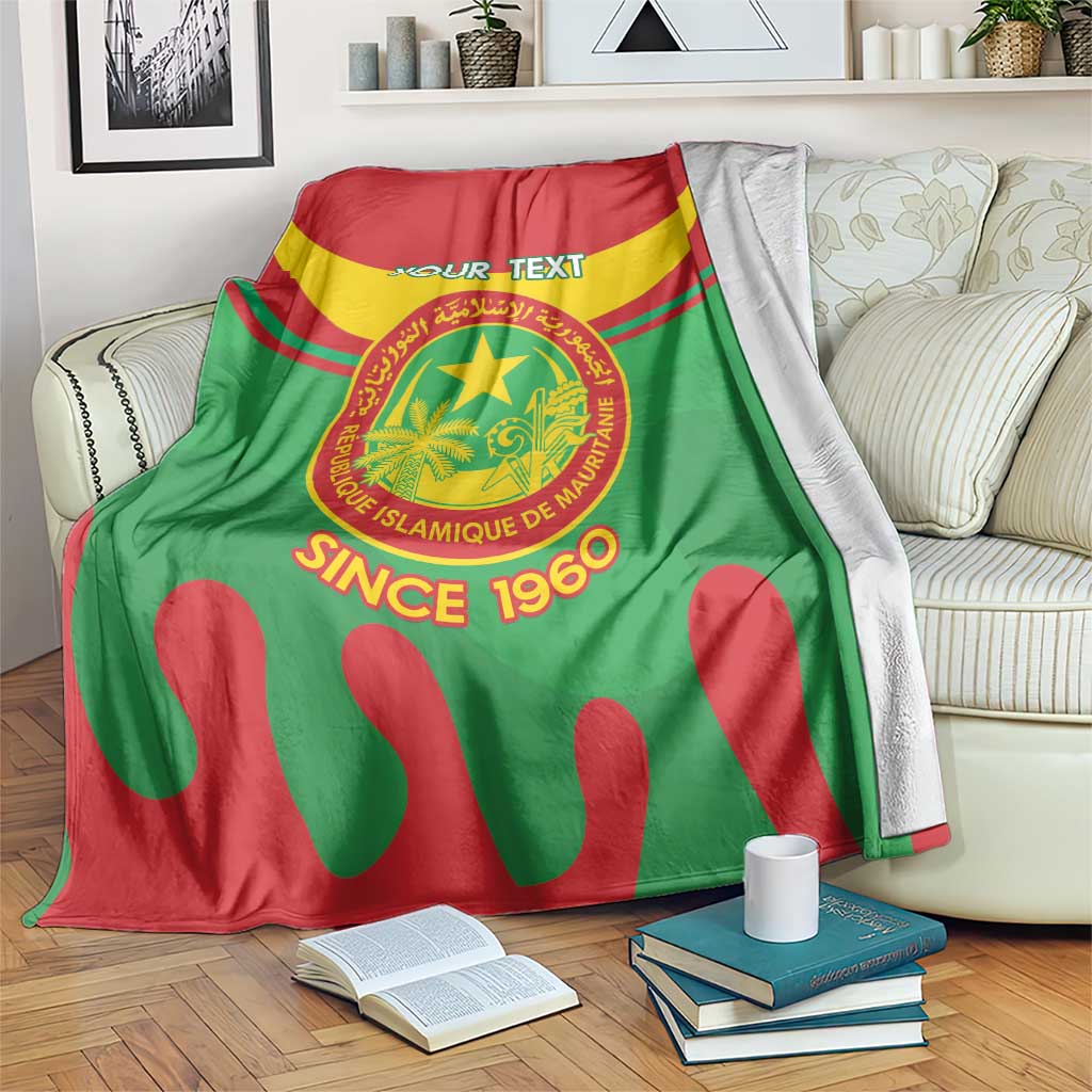 Mauritania flag-themed blanket with circular emblem, “YOUR TEXT”, draped over a sofa