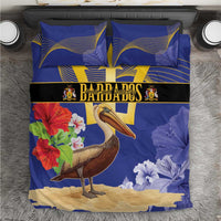 Blue duvet cover with pelican and flowers, gold trident emblem; includes two matching pillowcases