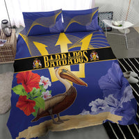 Blue bedding set with pelican, hibiscus flowers, and gold trident emblem; two pillowcases