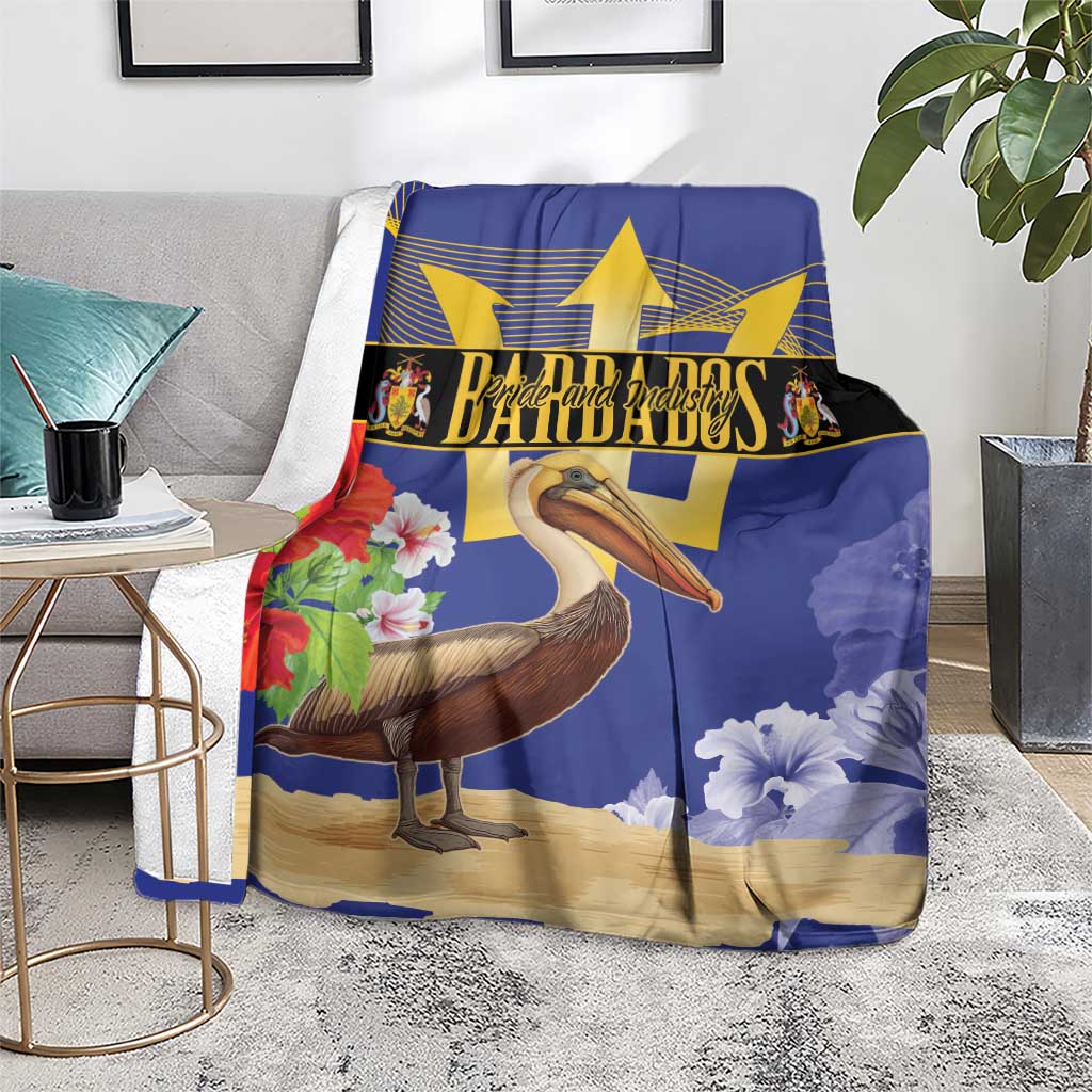 Blue decorative blanket with pelican, gold star emblem, and red flower corner