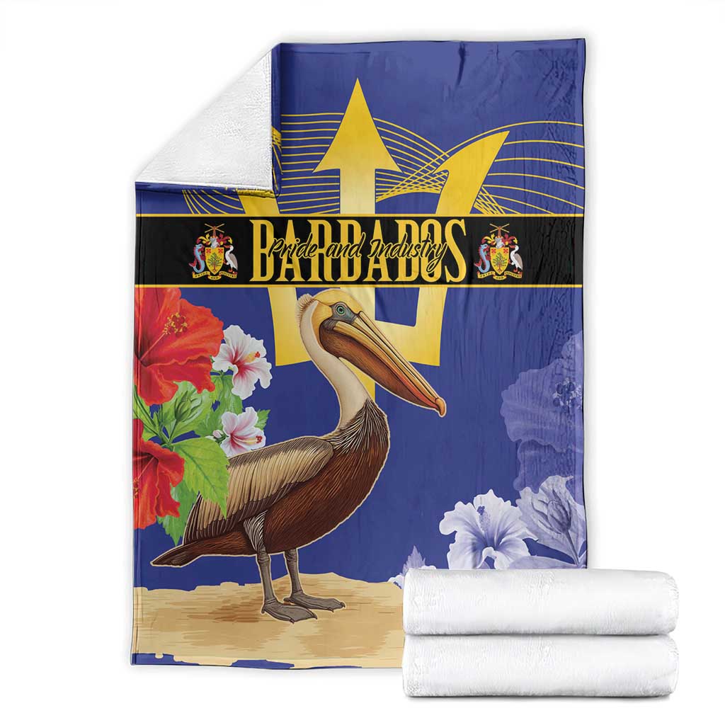 Blue blanket folded over stacks with gold star, pelican, and floral design