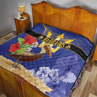 Blue Barbados quilt on bed showing trident banner, pelican artwork, and leaf motifs