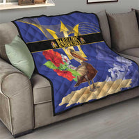 Blue Barbados quilt draped on sofa, featuring golden trident, pelican, and floral design