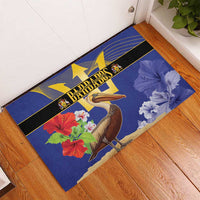 Blue rubber doormat laid in doorway, pelican and flowers with yellow star trident