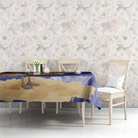 Blue tablecloth with pelican and trident motif on rectangular dining table