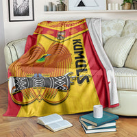Red-and-yellow rugby blanket with bird emblem, PNG crest, and vertical KUMUL text