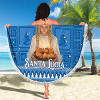 Round blue beach blanket with fringed edge featuring Santa Lucia candle graphic