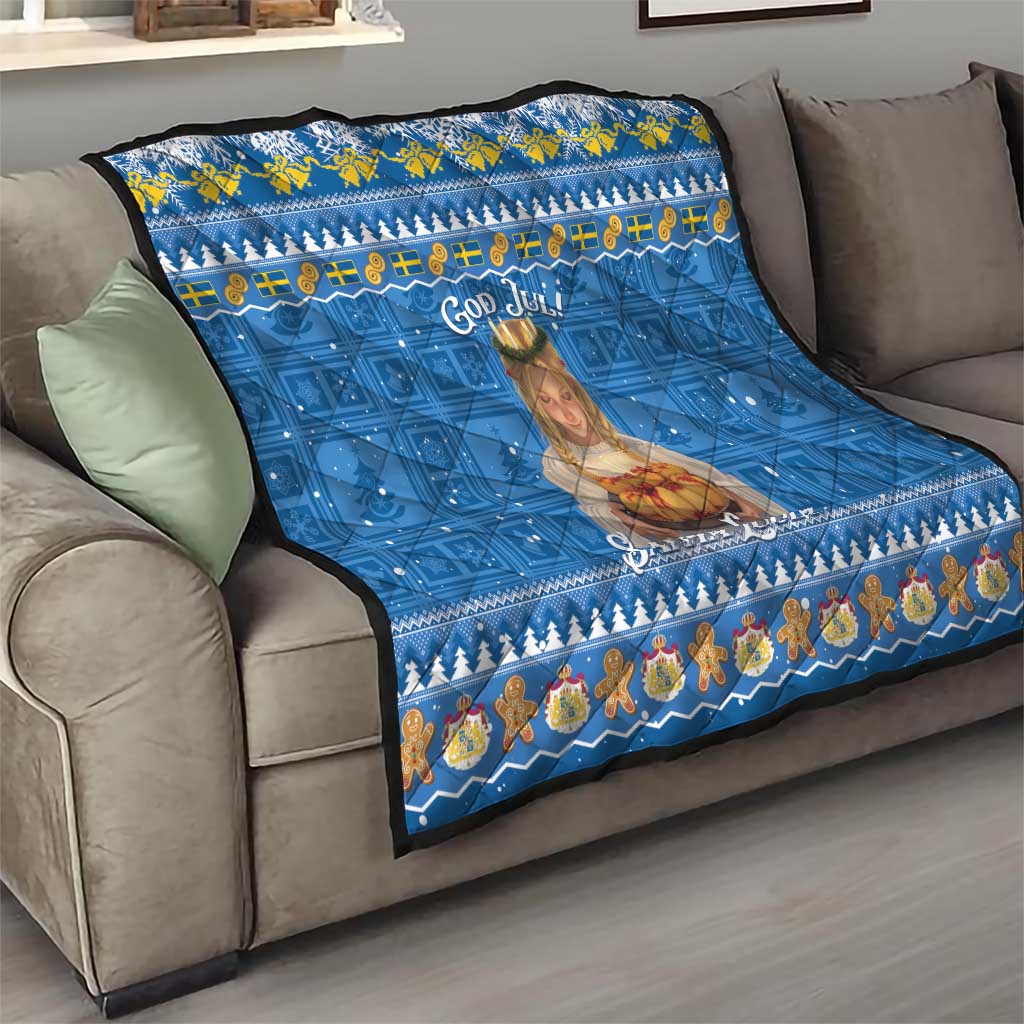 Blue God Jul Santa Lucia quilt on gray sofa, showing saint portrait and festive Nordic band.