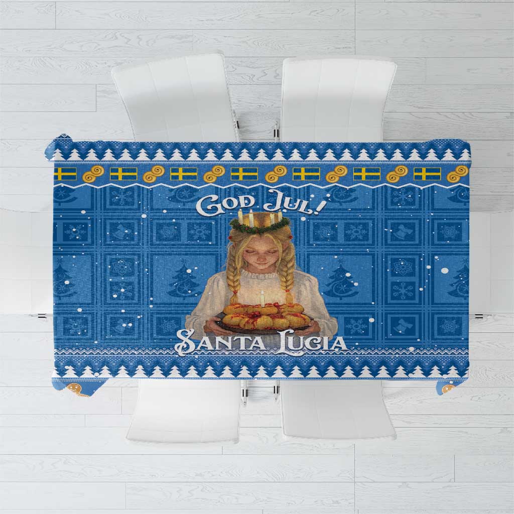 Blue holiday tablecloth with 'God Jul' text, Santa Lucia figure, and gingerbread border