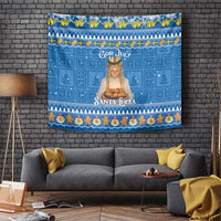 Blue Christmas tapestry with Santa Lucia figure, “God Jul!” text, and decorative border.