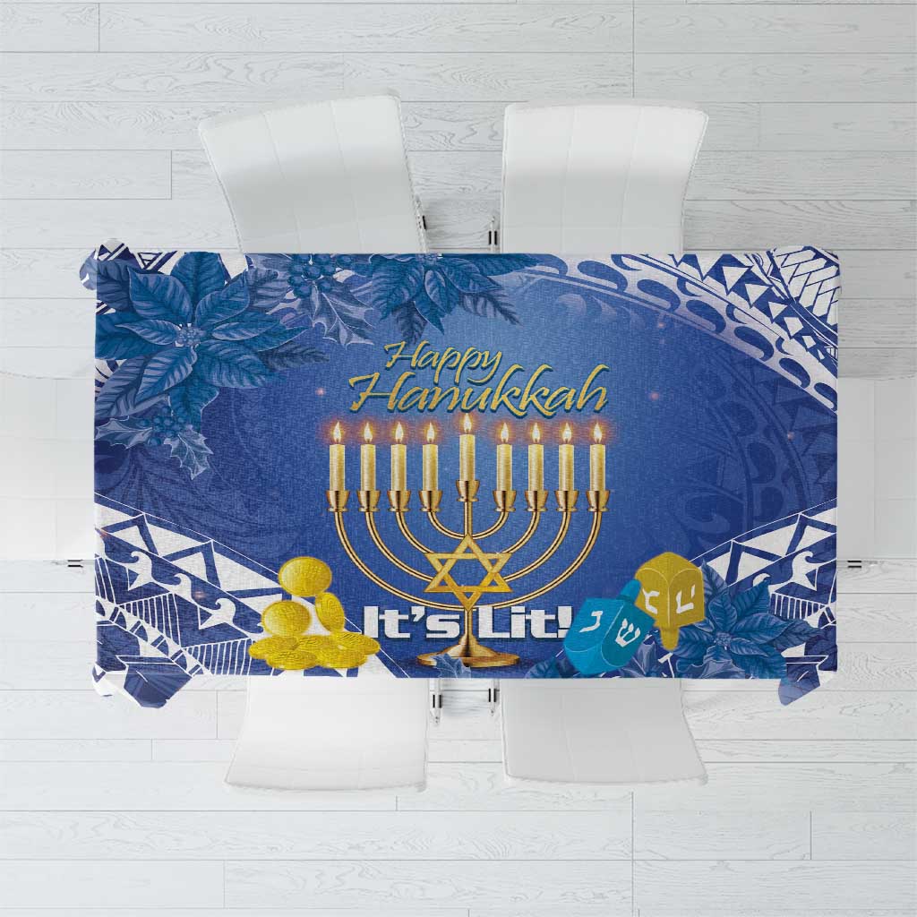 Blue Hanukkah tablecloth with tropical leaf and geometric pattern, menorah and “It’s Lit” text