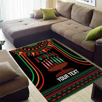 Black Kwanzaa area rug with kinara candle artwork, red-green zigzag border, custom text