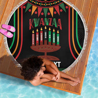 Round black Kwanzaa beach blanket with kinara candle graphic and tassel fringe edge