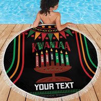 Round black Kwanzaa beach blanket, tassel fringe edge, kinara candle centerpiece