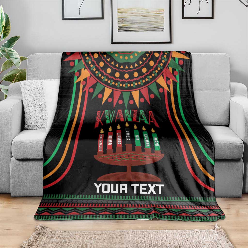 Black Kwanzaa kinara candle personalized blanket draped on sofa, with multicolor border
