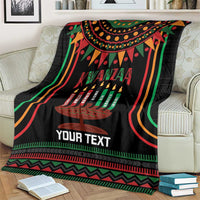 Black Kwanzaa kinara candle personalized blanket on couch with colorful concentric wave trim