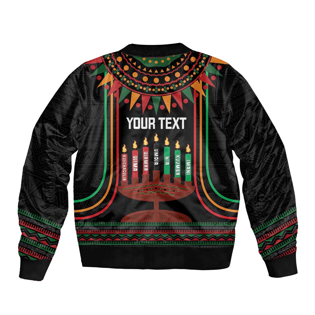 Black bomber jacket with kinara candles and 'YOUR TEXT' on back, zip front, striped trim