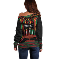 Off-shoulder black sweater with back 'YOUR TEXT' Kwanzaa kinara candle design