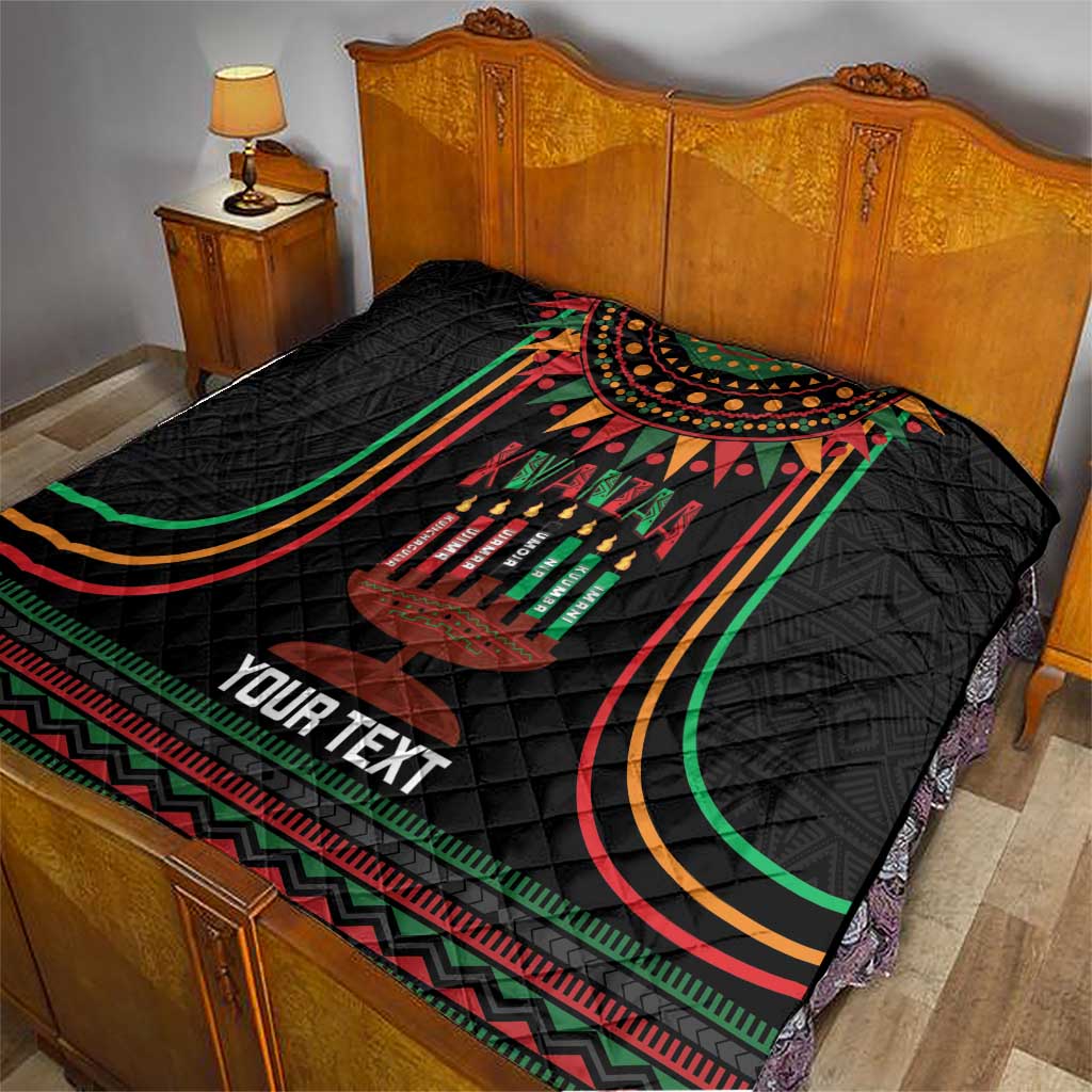 Black personalized Kwanzaa quilt blanket on bed with “YOUR TEXT” and multicolor frame