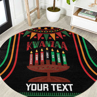 Black round Kwanzaa carpet with candle graphic, multicolor stripes, and 'YOUR TEXT'