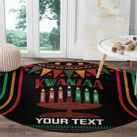 Black round Kwanzaa carpet with candle graphic, 'YOUR TEXT' and multicolor stripe border