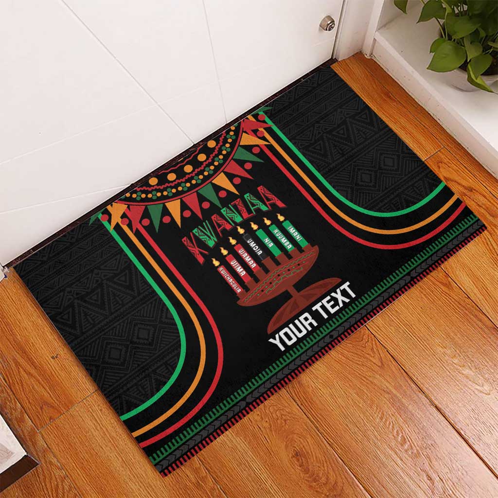 Black Kwanzaa rubber doormat with kinara candles, colorful borders, and 'YOUR TEXT'