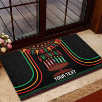 Black Kwanzaa rubber doormat with kinara candles, 'Kwanzaa' and 'YOUR TEXT'