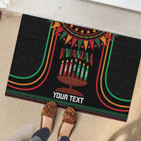Black Kwanzaa doormat with kinara candles and colorful arch stripes, 'YOUR TEXT'