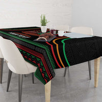 Black Kwanzaa tablecloth with colorful stripe border and kinara candles motif