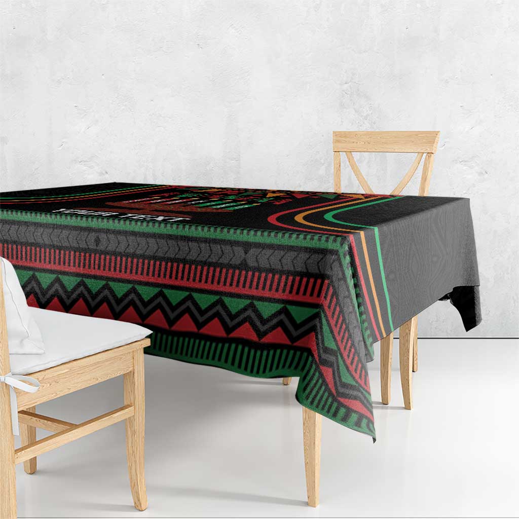 Black Kwanzaa tablecloth with geometric pattern border and hanging corner