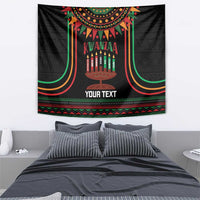 Black rectangular Kwanzaa tapestry with kinara candles, colorful arch border, and “YOUR TEXT”.