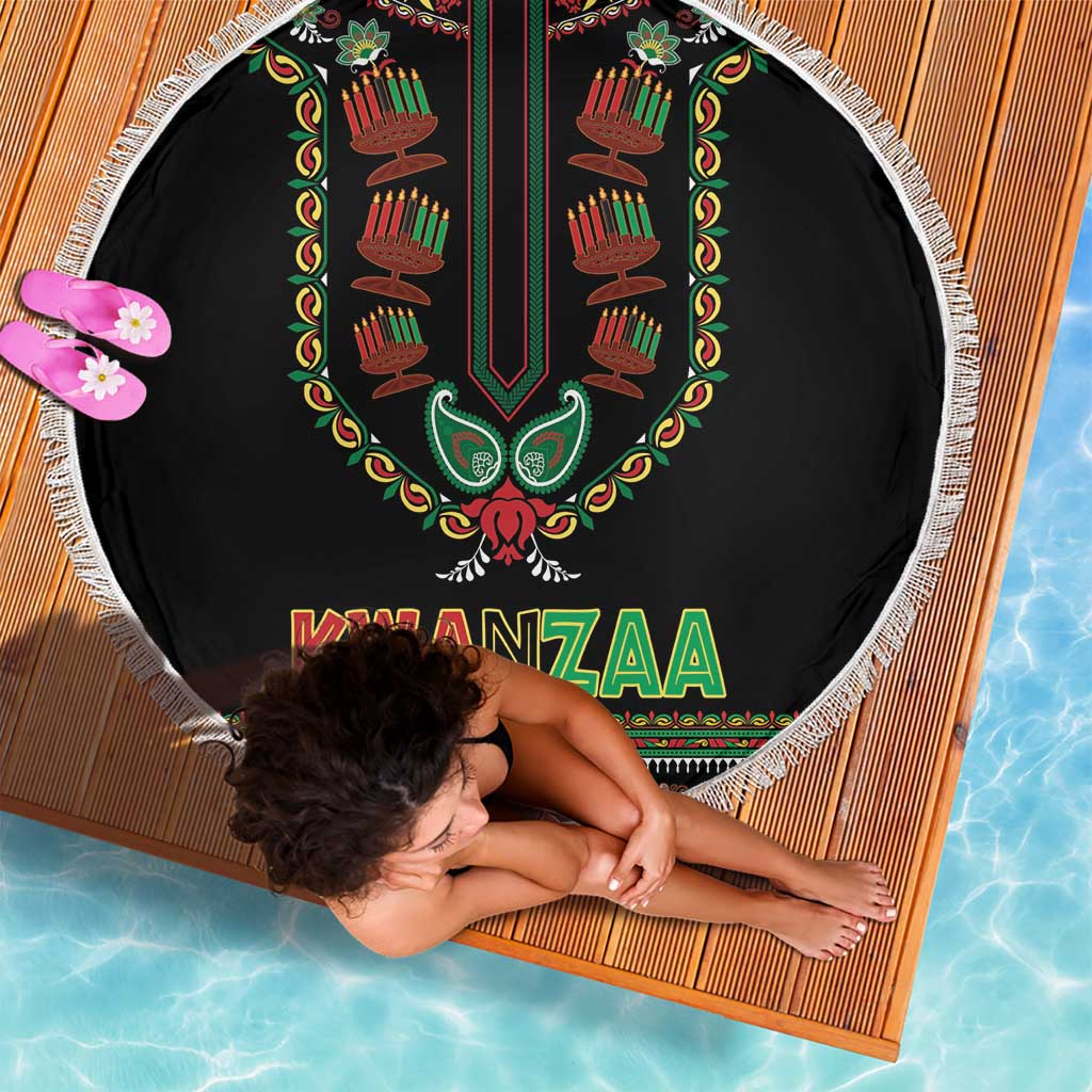 Round black Kwanzaa beach blanket with fringed edge, candle design and “KWANZAA” lettering