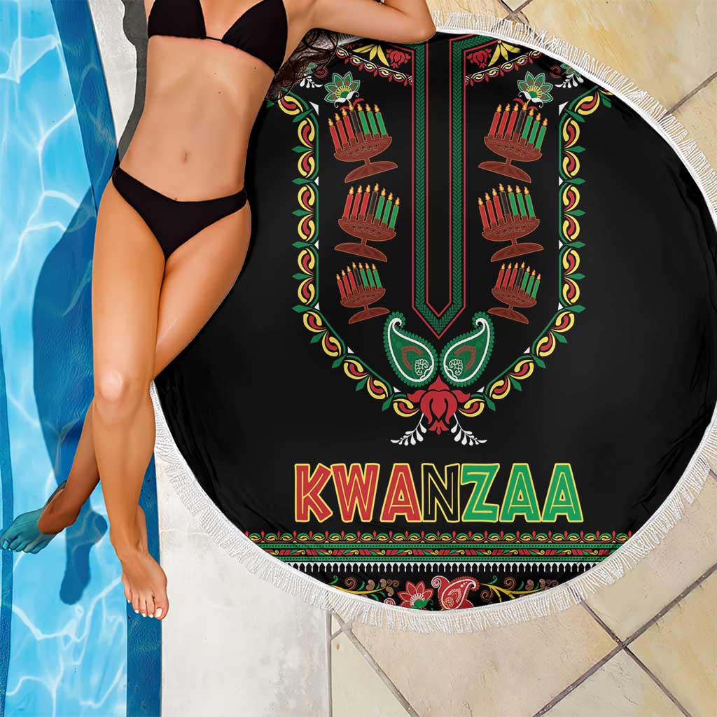 Round black Kwanzaa beach blanket with fringed border, candle artwork and “KWANZAA” text