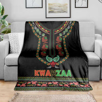 Black dashiki-style Kwanzaa blanket with bright medallion and decorative border