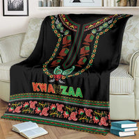 Black Kwanzaa dashiki blanket draped over sofa with colorful central design