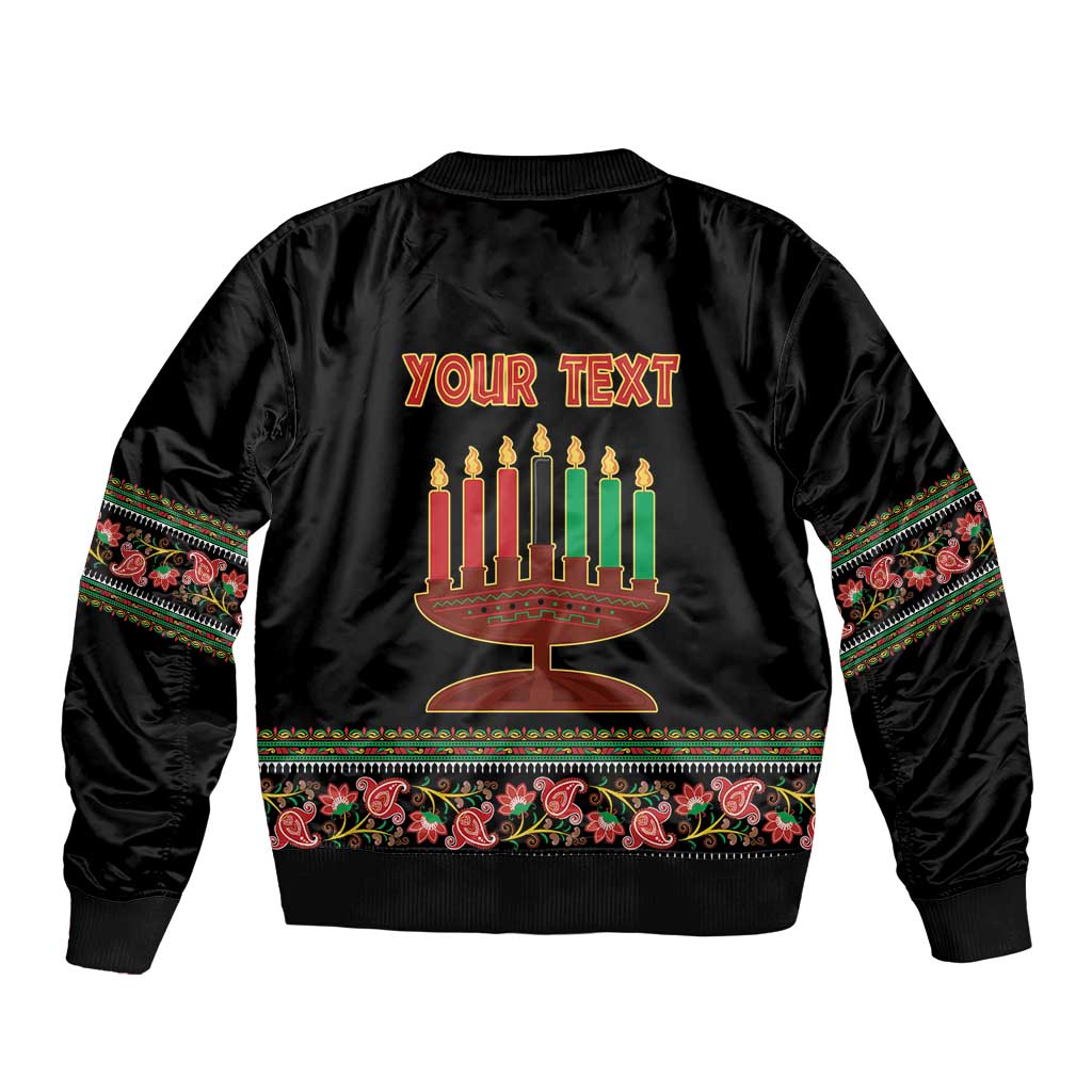 Black bomber jacket back with menorah graphic and banner, colorful patterned cuffs