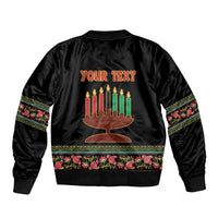 Black bomber jacket back with menorah graphic and banner, colorful patterned cuffs