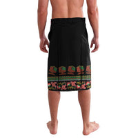 Black drawstring shorts with colorful Kwanzaa border print at hem