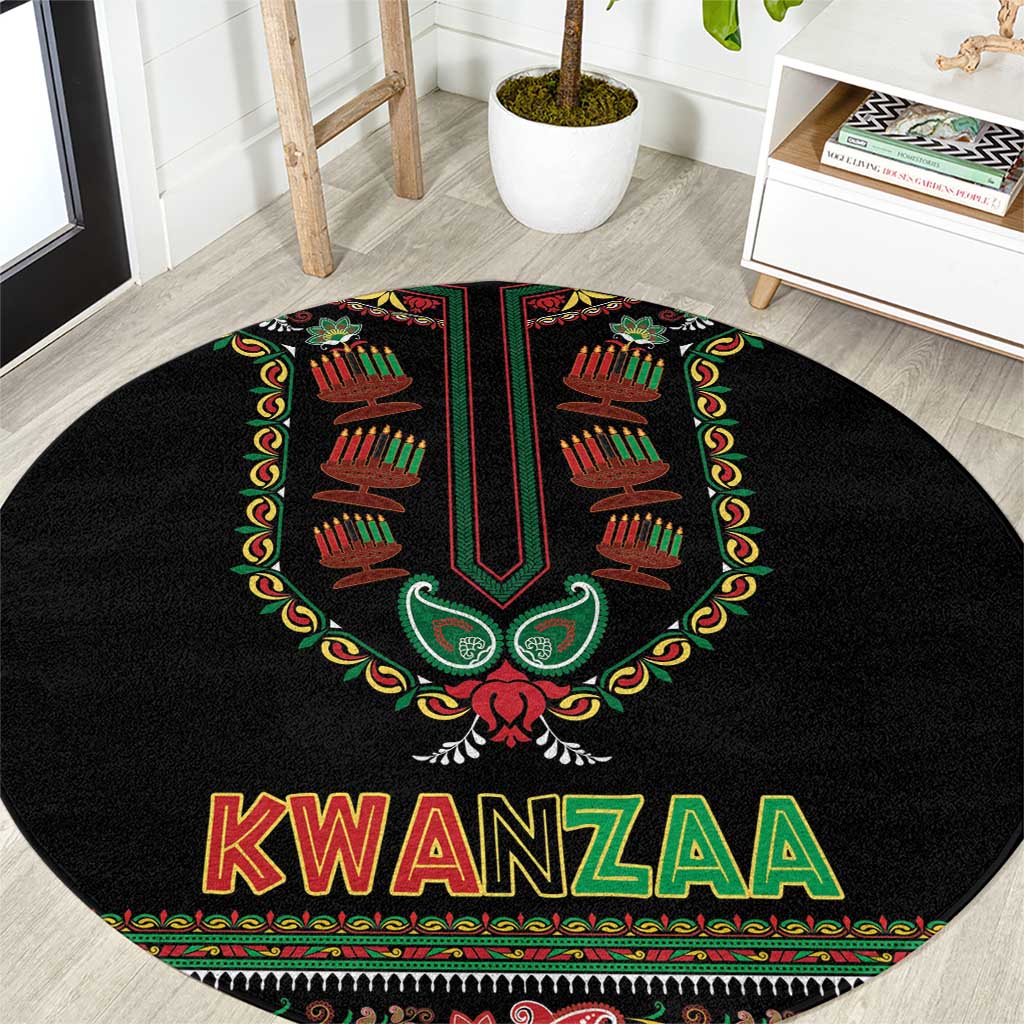 Black round Kwanzaa carpet with central emblem and colorful KWANZAA lettering