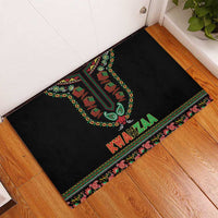 Black rubber doormat angled view with Kwanzaa candles and "KWANZAA" in red on colorful trim