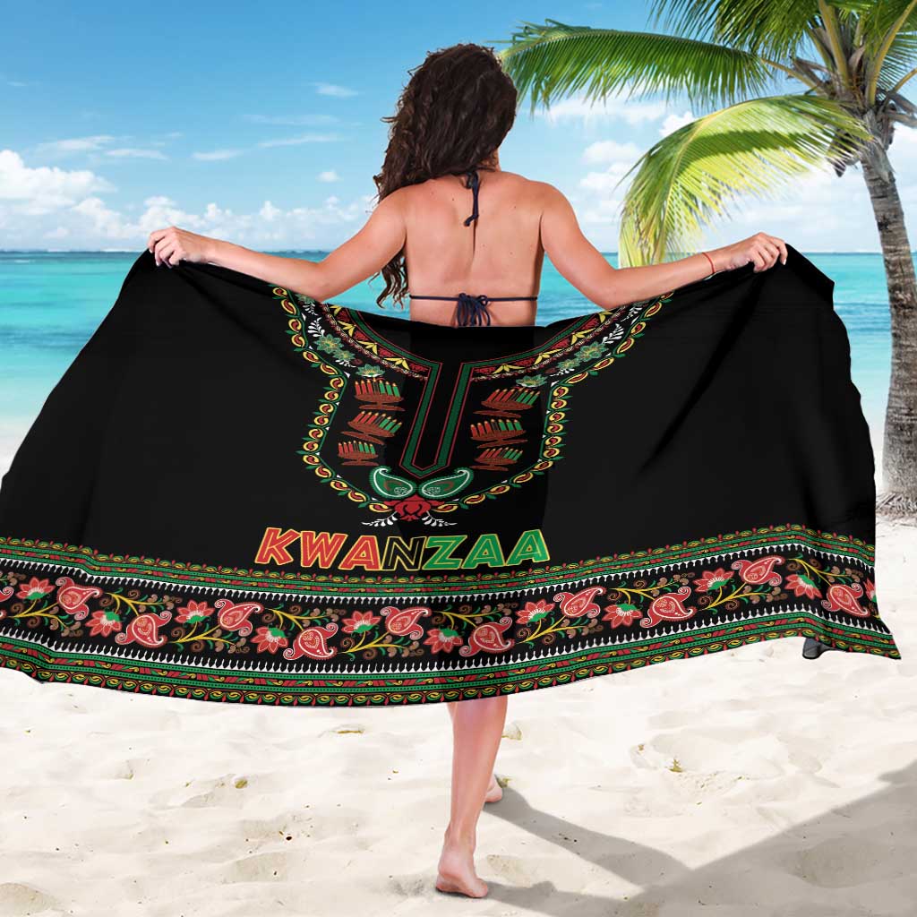 Black Kwanzaa sarong worn like a back cover with large “KWANZAA” graphic