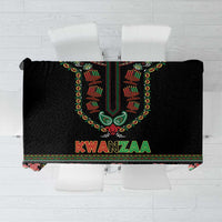 Black tablecloth with colorful Kwanzaa emblem and paisley-style border
