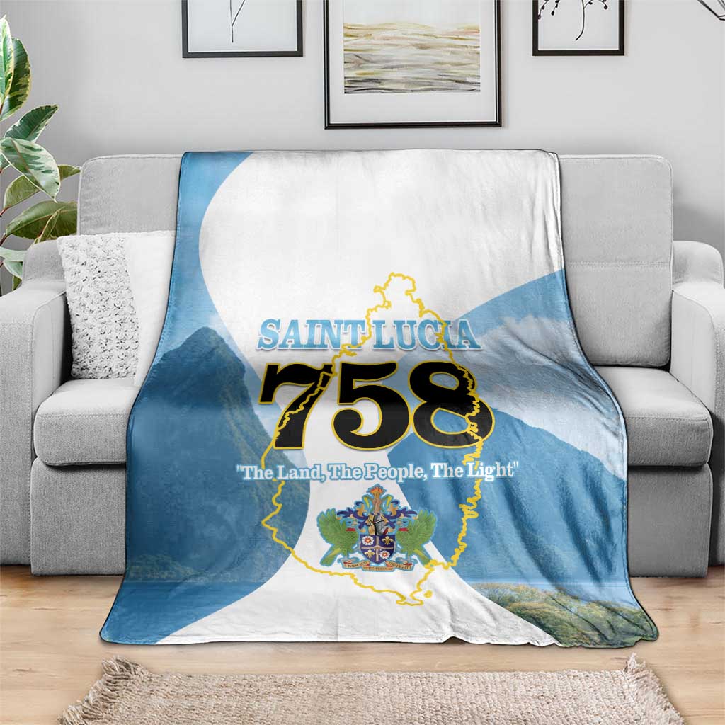 Blue and white Saint Lucia 758 blanket on gray sofa, large center map graphic