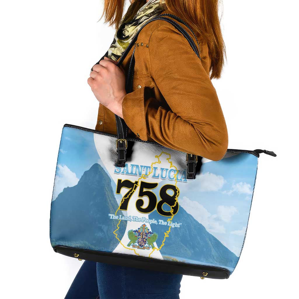 Blue tote bag with black trim and handles, Saint Lucia 758 map graphic on front.