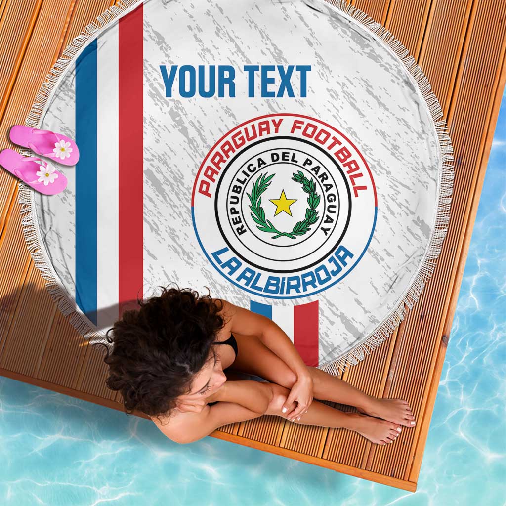 Paraguay football beach blanket, white round fringe with crest and tricolor stripes, top view.
