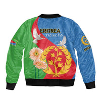 Bomber jacket with blue and green panels, black ribbed trim, 'ERITREA' print with dove and flowers