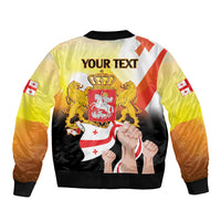 Yellow bomber jacket with full back graphic crest, lions, and flag sleeve details