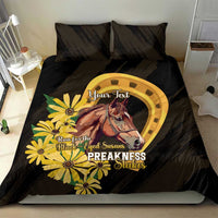 Black bedding set with yellow horseshoe-style ring, horse and daisy graphic, 2 pillows